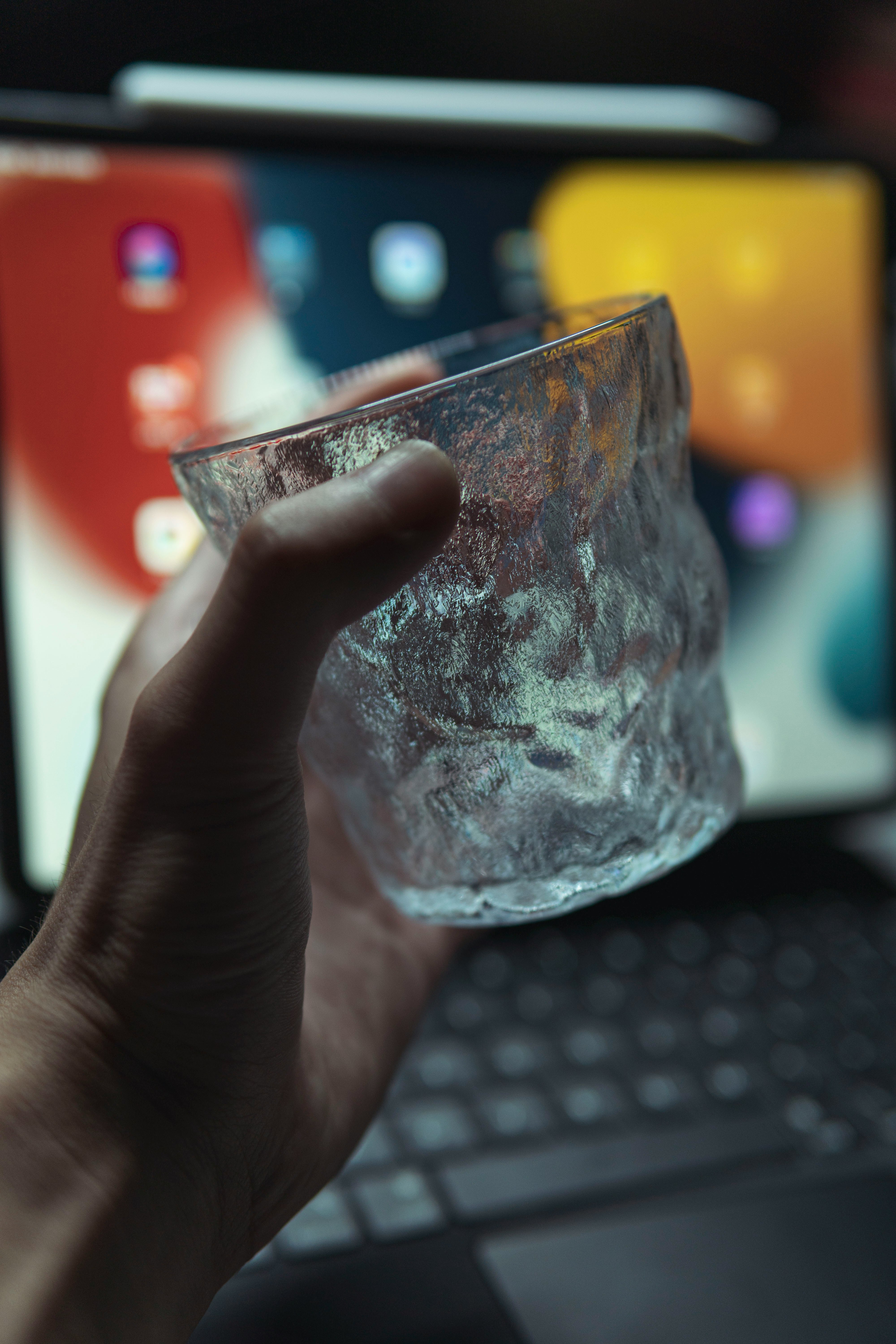 person holding clear glass cup